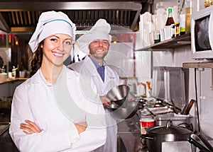 Cooks greeting customers at bistro