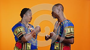 Cool african american couple greeting with fist bump