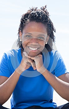 Cool african american woman in a blue shirt