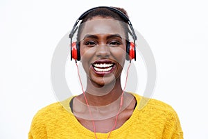 Cool african american woman listening to music with headphones