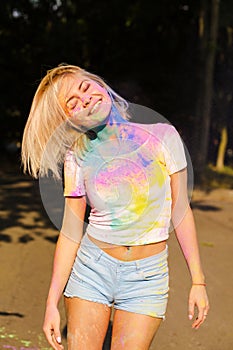 Cool attractive woman in white t shirt with hair in wind covered