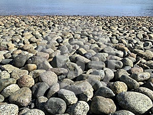 Cool background stones on the beach when the sea is clam