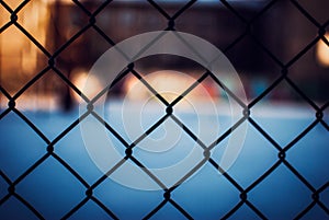 Cool background of a wired fence with a blurred background - great for background or wallpaper