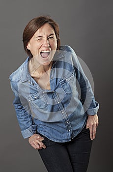 Cool beautiful middle aged woman making a dynamic funny face
