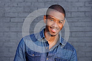Cool black guy smiling with blue shirt