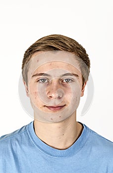 Cool boy with blue shirt posing in studio