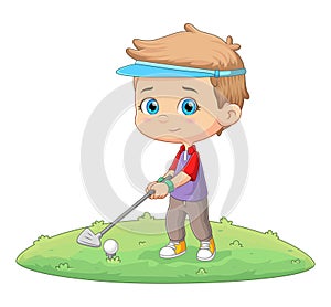 The cool boy is playing golf in the golf course and ready to hit