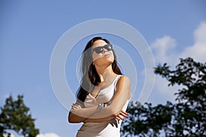 Cool brunette teenage girl with sunglasses