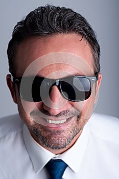 Cool business man wearing shades or sunglasses