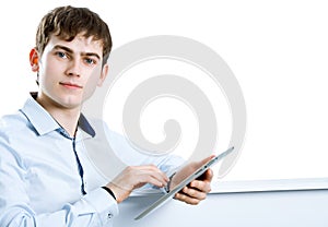 Cool businessman using electronic tablet