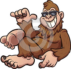 Cool cartoon bigfoot resting and wearing sunglasses.