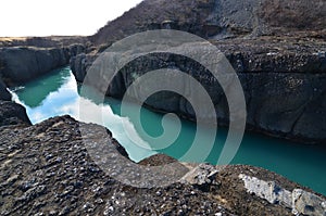 Cool channel in Iceland going through large rocks