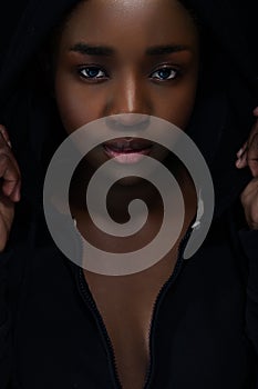 Cool and confident woman with dark skin and attitude wearing hoodie