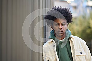 Cool confident young gen z hipster African American guy outdoors. Portrait