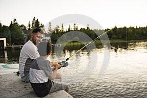 Cool Dad and son fishing on lake