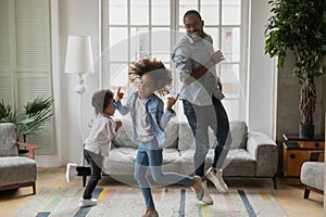 Cool daddy entertaining two children at home