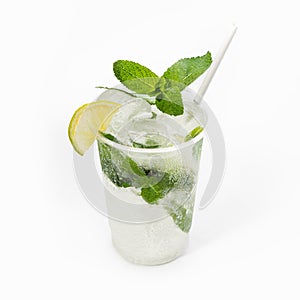 Cool delicious mojito cocktail decorated with mint and a slice of lime. Close-up, on a white background. Mock up