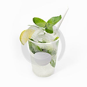 Cool delicious mojito cocktail decorated with mint and a slice of lime. Close-up, on a white background. Mock up