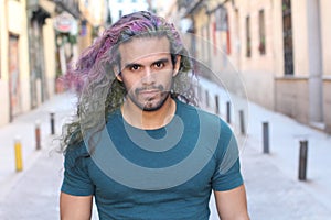 Cool ethnic man with multicoloured dyed hair