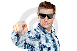 Cool fashionable guy pointing at you