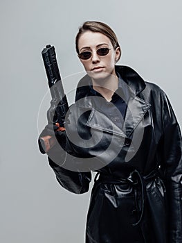 Cool female spy holding a gun