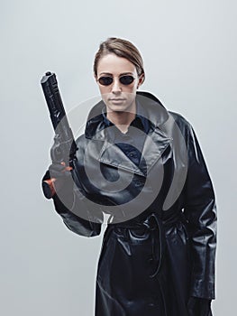 Cool female spy holding a gun