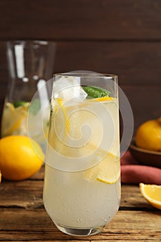 Cool freshly made lemonade on wooden table