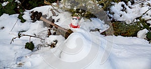 Cool funny Santa Claus with sun glasses sitting on the snow