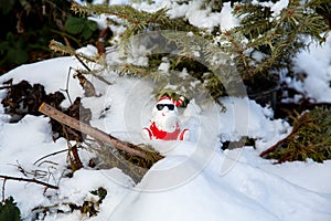 Cool funny Santa Claus with sun glasses sitting on the snow