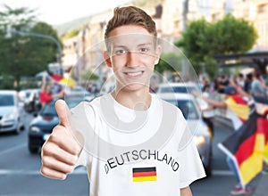 Cool german fan showing thumb with other fans