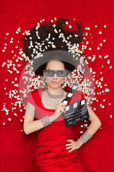 Cool Girl with 3D Cinema Glasses, Popcorn and Director Clapboard