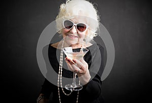 Cool grandma havinga a drink