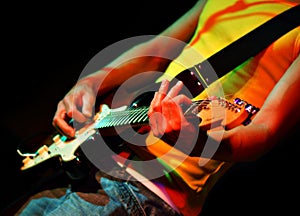 Cool guitarist in rock concert photo