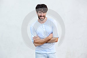 Cool guy with beard smiling against white background