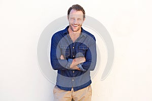 Cool guy laughing against white background