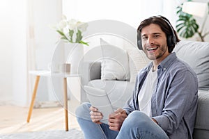 Cool guy with wireless headset and digital tablet