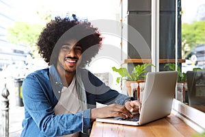 Cool guy working with laptop