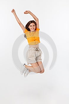 Cool hipster portrait of young stylish teen girl showing her hands up, positive mood and emotions,travel alone. Isolated