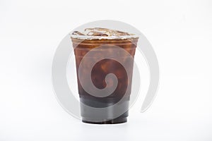 Cool iced americano coffee, fresh coffee shot with ice cubes water in a plastic glass 16oz. isolated white background