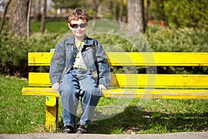 Cool kid sitting on bench