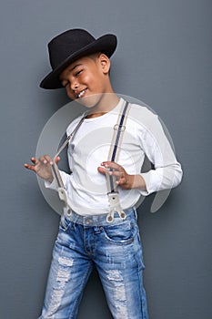 Cool kid smiling with hat and suspenders