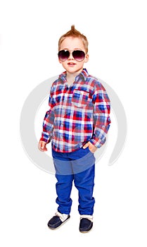 Cool little boy posing on white background