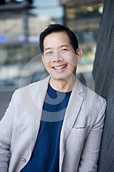 Cool middle aged asian man smiling