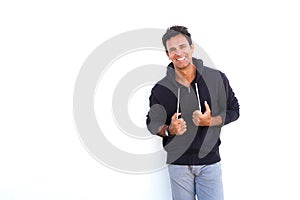 Cool middle aged man smiling against white background
