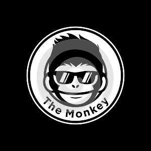 Cool monkey wearing glasses logo vector design illustration. monkey head/face icon. ape face icon. monkey emblem vector