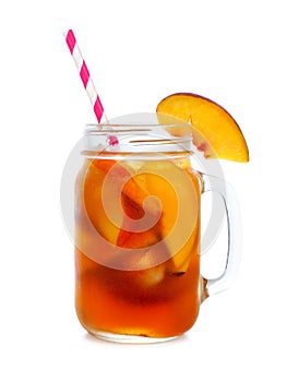 Cool peach iced tea in a mason jar glass isolated on white