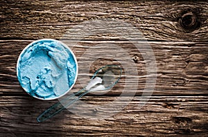 Cool refreshing blue Italian ice cream in a tub