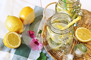 Cool refreshing drink: ice, lemon and mint