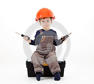 Cool repairman in hardhat with pliers and screwdriver on white