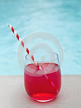 Cool summer cocktail by the pool stripe straw